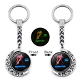 Glow-in-the-dark Aquarius constellation keychain with a rotating silver crescent moon - Aquarius