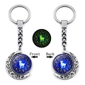 Glow in the dark Aries zodiac keychain with double-sided rotating moon pendant - Aries