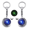 Luminous Leo zodiac moon keychain with rotating double-sided glass pendant and glow effect - Leo