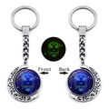 Rotating Leo zodiac moon keychain with luminous green glow in the dark effect - Leo