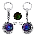 Glow-in-the-dark Pisces zodiac keychain with rotating double-sided moon pendant - Pisces