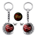 Detailed view of Aquarius glowing keychain with silver moon frame and red nebula glass - Aquarius (XSWX4671-10)