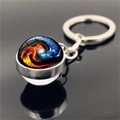Macro view of yin yang fire and ice artistic glass ball pendant on silver metal keychain - Fire and Ice Silhouette(XSWX4433-11)
