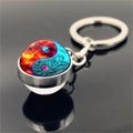 Macro shot of Yin Yang keychain with red and blue fire-water glass dome and metal ring - Ice and Fire Yin Yang(XSWX4433-8)