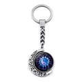 Detailed view of rotating Yin Yang moon keychain with silver metallic frame and blue glass inlay - Blue Purple Energy Pattern Tai Chi Style (XSWX4434-10)