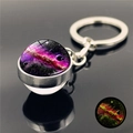 Luminous galaxy glass ball keychain in silver metal with purple nebula and glow effect - Purple Galaxy