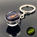Luminous solar system keychain with golden nebula glass ball and silver metal ring - Vortex Nebula