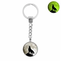 Luminous howling wolf keychain with glowing moon pendant in polished silver metal finish - Wolf Howling Moon Silhouette (XSWX4773-1)