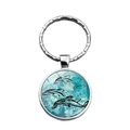 Porte-clés argenté avec pendentif rond orné de dauphins tribaux sur un fond bleu-vert - Style Dauphin Totem Abstrait (XSWX5111-7)