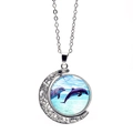 Rotating moon pendant necklace with silver crescent and blue ocean dolphins graphic - Double Dolphin Style (XSWX5107-1)