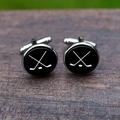 Close-up of hockey theme cufflinks with crossed sticks on textured wooden surface - Hockey Pattern (5HXK0100-5)