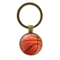 Porte-clés vintage en bronze avec motif basketball sous un pendentif dôme en verre - Basket-ball - Bronze Antique