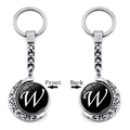 Rotating silver moon keychain with letter W pendant on white background, front and back view - Initial W Style (XSWX5286-W)