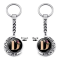 Detail of a rotating silver moon keychain with floral letter D on both sides - Initial D Floral Style (XSWX5492-D)