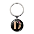 Detail of silver metal keychain with letter D and floral design under glass cabochon - Letter D (XSWX5495-D)