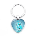 Blue butterfly heart-shaped glass gemstone keychain with silver metal ring pendant - Three Blue Butterflies Flying Over Water Silver Frame (XSWX5582-3)