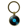 Vintage bronze vinyl record keychain featuring a glass dome and blue musical design - Antique Bronze Pattern 7