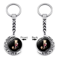 Rotating moon keychain with golden letter J and floral motif on black glass base - Initial J Floral Style (XSWX5492-J)