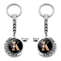 Rotating moon keychain with letter K and floral pattern shown front and back view - Initial K Floral Style (XSWX5492-K)