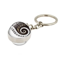 Detailed side view of music piano key and golden note patterns inside a glass dome keychain - Vortex Music Art Style (XSWX5700-8)