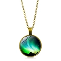 Detailed close-up of a vintage bronze necklace with a green Northern Lights glass cabochon - Bronze Green Aurora Style (ABXL350-6)