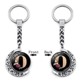 Rotatable moon keychain with silver finish and floral letter O pendant front and back views - Initial O Floral Style (XSWX5492-O)