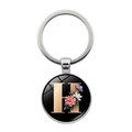 Silver metal keychain featuring a black round pendant with letter H and floral pattern - Letter H (XSWX5495-H)