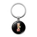 Silver alphabet keychain with letter I featuring pink floral pattern on black background - Letter I (XSWX5495-I)