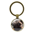 Close-up of bronze puppy keychain with pug glass pendant on clear white background - Cute Head-Tilt Pug (XSWX5758-9 Antique Bronze)