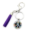 Portachiavi con segno della pace con nappa in pelle scamosciata viola e ciondolo floreale - Simbolo della Pace Floreale Viola (XSWX5769-4)