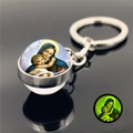 Glow-in-the-dark Virgin Mary glass ball keychain with luminous green light effect - Madonna and Child 16 (XSWX2486-16)