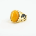 Gold ring with oval yellow gemstone and Yin Yang relief on a textured white background - US 7 / Gold Setting Yellow Cat Eye