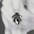 Gothic obsidian pendant necklace with silver eagle claw design on marble background - Pendant With Chain