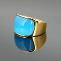 Massiver Goldring mit großem rechteckigen blauen Edelstein und Katzenaugeneffekt - Goldbasis Blauer Stein