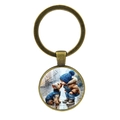 Portachiavi vintage in bronzo con ciondolo rotondo e illustrazione di ragazzo e cane - Bronzo Antico