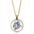 Detailed macro view of vintage bronze round pendant with colorful tribal horse pattern - Antique Bronze