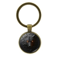 Vintage bronze wolf head keychain with glowing orange eyes and glass dome pendant - Antique Bronze