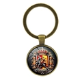 Portachiavi souvenir Spagna vintage in bronzo con cupola in vetro torero su sfondo bianco - Bronzo Antico