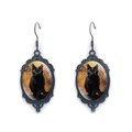 Macro detail of gothic oval drop earrings featuring a black cat motif and baroque frame - Baroque Black Cat Pattern (XSWX9057-9)