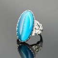 Anello vintage in acciaio con grande pietra occhio di gatto blu cielo e incisioni floreali - Tono Argento Pietra Blu Pavone