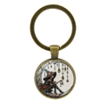 Vintage bronzen maan heks sleutelhanger met glazen cabochon en fantasie kunst - Antiek Brons
