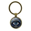 Detail eines Vintage Bronze Schlüsselanhängers mit blauem Evil Eye Glasanhänger - Antik-Bronze (XSWX8208-1)