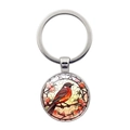 Porte-clés colibri en argent avec pendentif en verre coloré sur un fond blanc pur - Oiseau à Poitrine Rouge (XSWX8211-6)