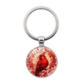 Détail d'un porte-clés en métal avec un motif colibri coloré sur un pendentif rond - Cardinal Rouge (XSWX8211-5)