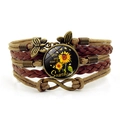 Macro detail of sunflower glass pendant and infinity charm on bohemian braided leather bracelet - You Are My Sunshine Style (XSWX8237-4)
