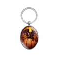 Halloween oval pendant keychain featuring a bat on a pumpkin with silver metal ring - Bat on Pumpkin Style (XSWX8259-5)
