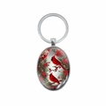 Polished oval keychain with Northern Cardinal birds on pine branch for winter decor - Cardinal Bird Pattern (XSWX8287)
