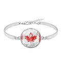 Detail view of the silver metal bracelet with a lobster clasp and Canada flag pendant - Worn Texture Canada Flag Style (XSWX8424-8)