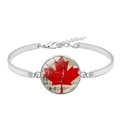 Minimalist silver bracelet with Canada flag glass cabochon on a clean white background - Vintage Wood Grain Maple Leaf Style (XSWX8424-4)