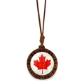 Detailed close-up of Canada flag maple leaf pendant with brown wood carved frame - Dark Brown Carved Wood Maple Leaf (XSWX8428-10)